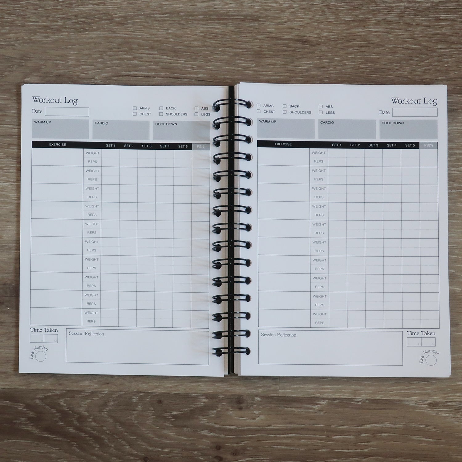 Workout Log Book Training Plans Open On A Wooden Desk