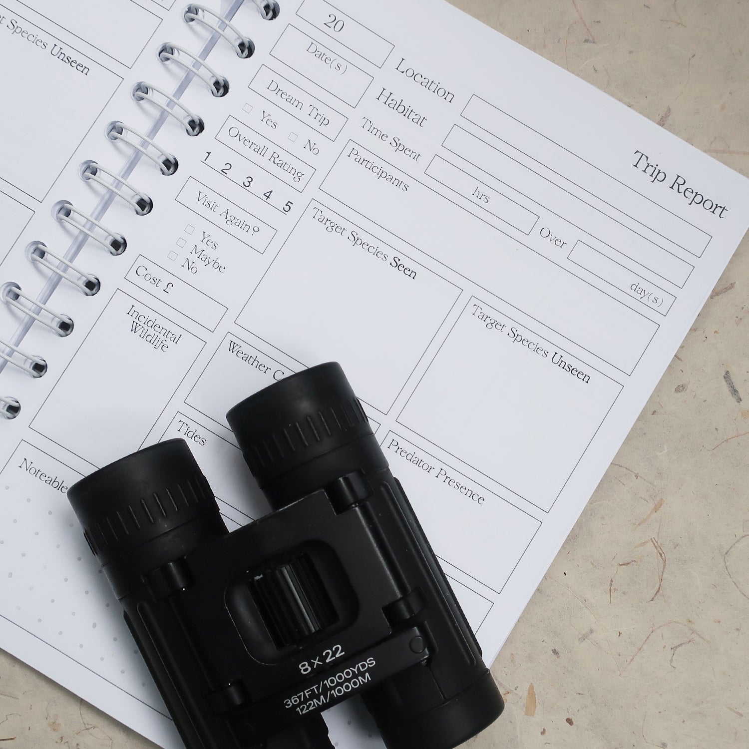 wayzgoose Bird Watching Log Book Open On The Trip Report Page, Laid On A Textured Background With Black Binoculars 